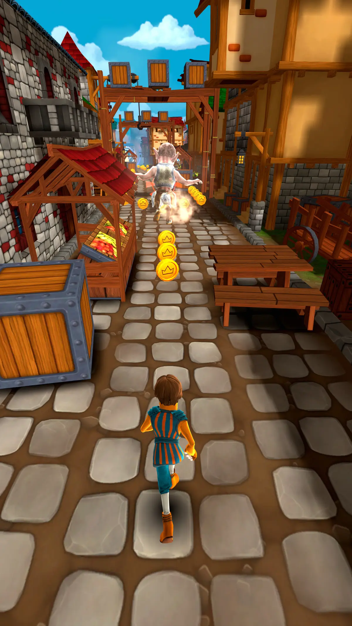 A chaser in a blue tunic runs through a market past a fruit stall and bench toward a fleeing gnome robber
